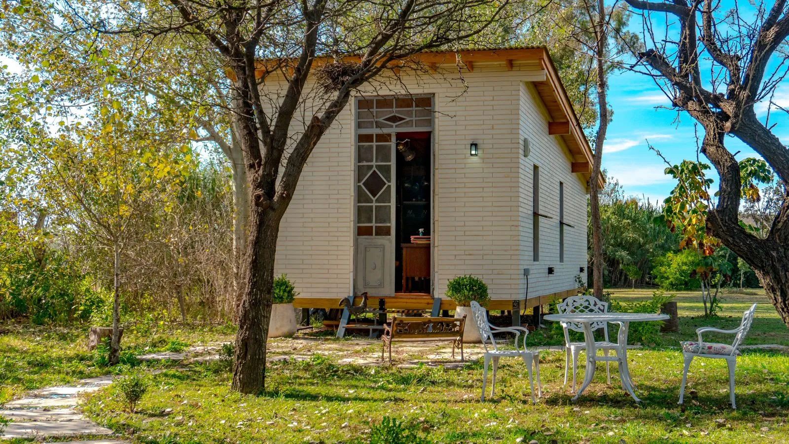 Compact wooden block cabin in a garden